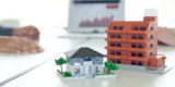 Two House Models on an Office Desk